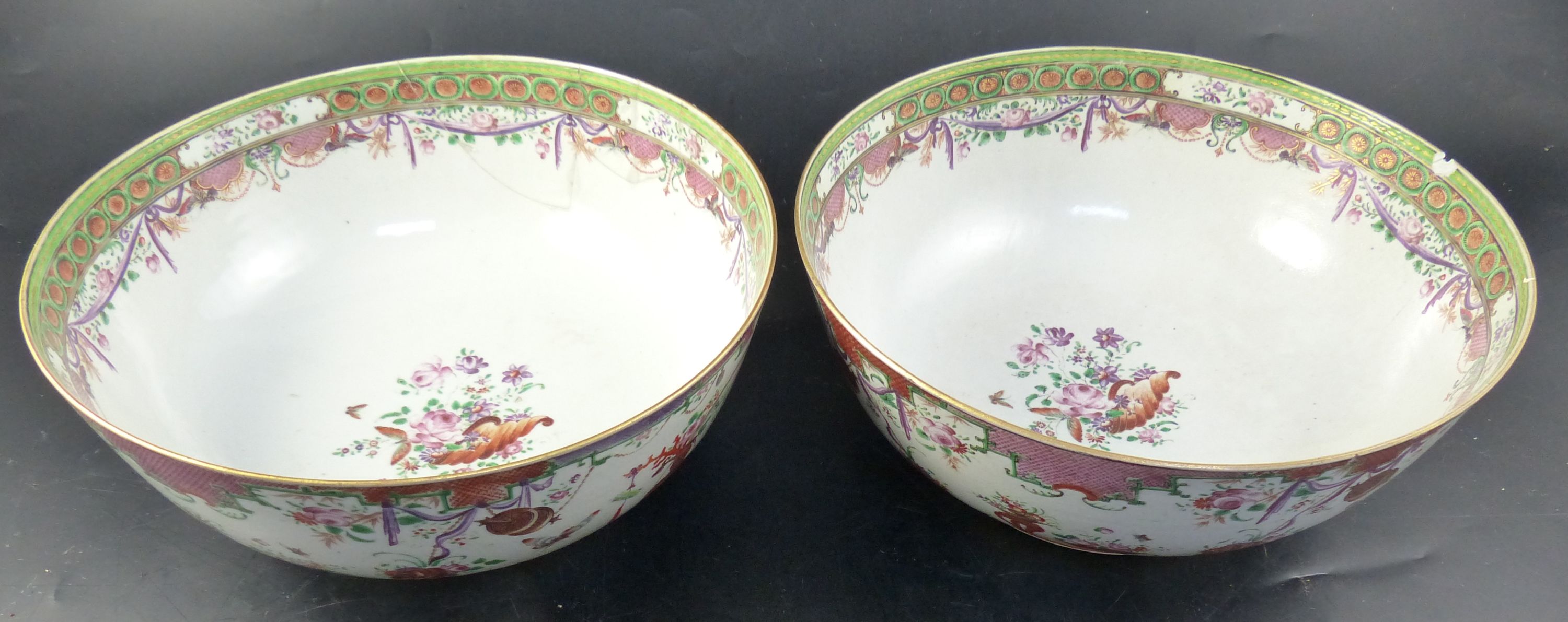 A pair of famille rose punch bowls, Qing dynasty, 18th century, diameter 29cm (both a.f.)